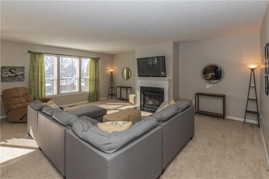 Large Great Room is anchored by gas fireplace and offers lots of natural light