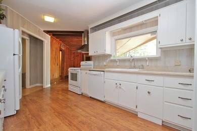 Enjoy the tree-lined from from the window over the kitchen sink.