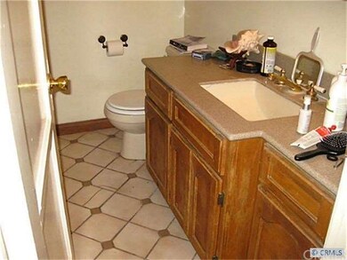 ceramic tile flooring and newer style cabinet.