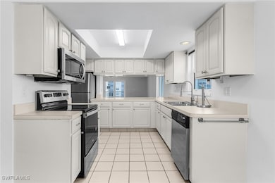 Kitchen with stainless steel appliances, light til