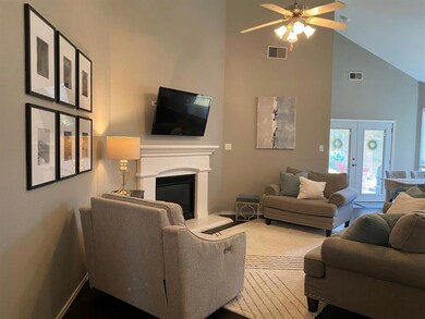 Living area with soaring ceilings.