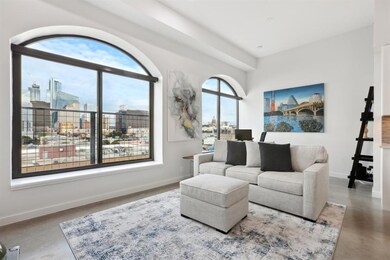 Living room with a view of city and baseboards