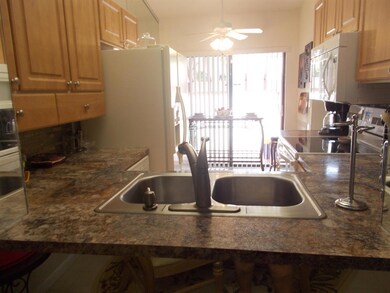 LOOKING INTO KITCHEN FROM DINING AREA