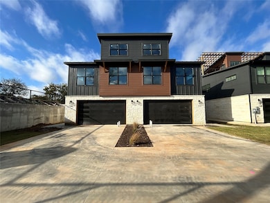 View of front of property with stone siding, concrete driveway, an attached garage, and board and batten siding