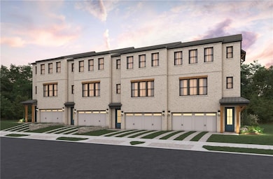 View of front of home with brick siding and driveway