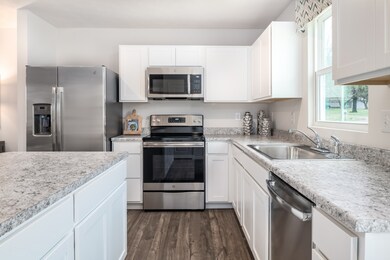 Kitchen includes ALL of your appliances, tons of cabinets for storage, and a beautiful island perfect for some additional prep space!  *Model Photo for reference*