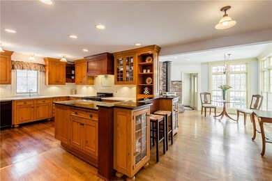 Designer cook's kitchen with dining area and creek