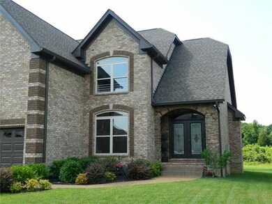 Extensive Landscaping, Stone accents, 2 car garage w/ pedestran door