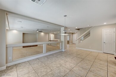 Empty room featuring light tile patterned floors,