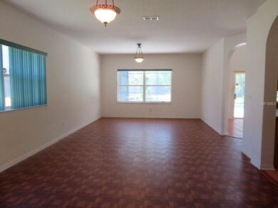 Dining Room Looking into Living Room with Pool Vie