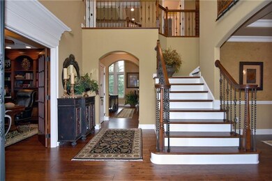 The two-story foyer introduces exceptional details