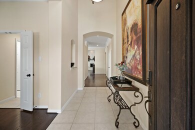Welcoming entry with soaring ceilings.