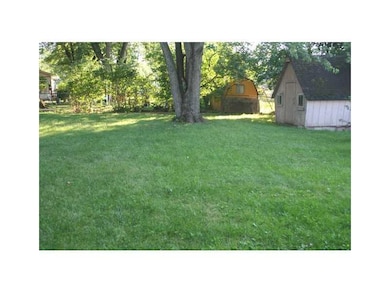 Yard. Nice fenced yard with mature trees and storage barn