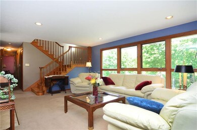 FAMILY ROOM WITH GENEROUS SIZE WINDOW OVERLOOKING 