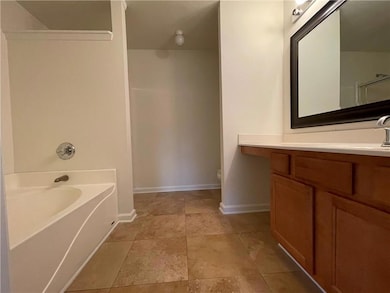 Full bathroom featuring vanity, a bathtub, and a shower