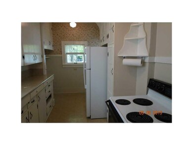 Kitchen. Built in shelves above stove