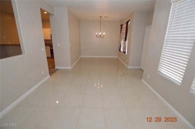 Unfurnished room featuring light tile patterned fl