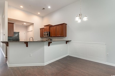 Kitchen featuring dark hardwood / wood-style floor