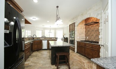 Beautiful kitchen with stone accent wall! Stainless appliances!