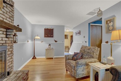 Family room with brick gas fireplace.