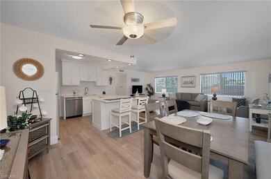 Dining area with light wood-style flooring, a weal