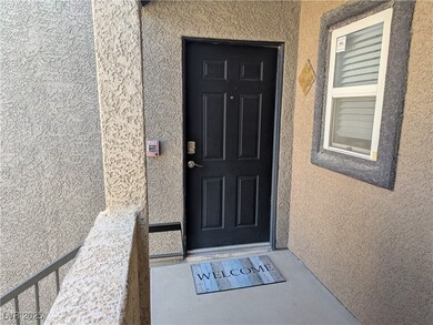 Entrance to property featuring stucco siding