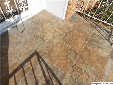 Tile on Porch with Wrought Iron Railing