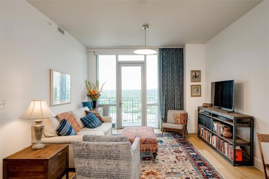 Living area with expansive windows and light wood