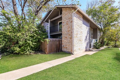 View of home's exterior with stone siding and a balcony