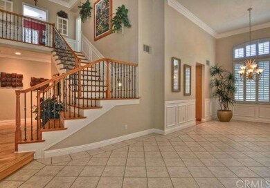 Spacious floorplan and beautiful staircase greet y
