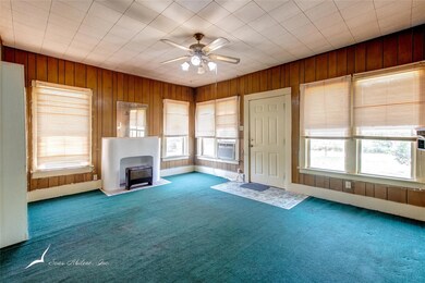 Looking west through the living room. Gas fireplac