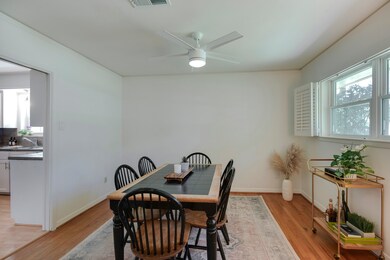 Formal dining room has hardwood floors, new paint,