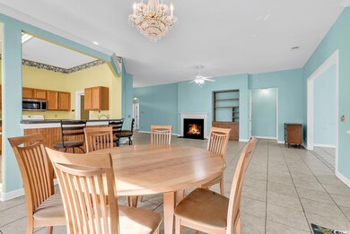 Dining room featuring light tile patterned floorin