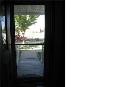 Looking out the front storm door from entry way.