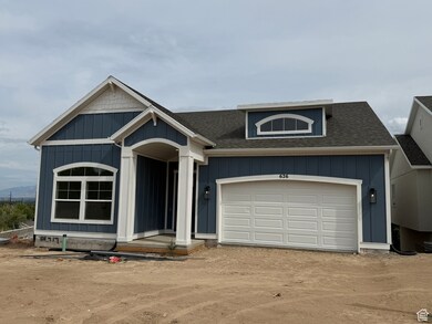 View of front of house featuring board and batten siding, roof with shingles, dirt driveway, and a garage
