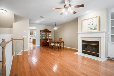 Dining area with visible vents, a fireplace with f