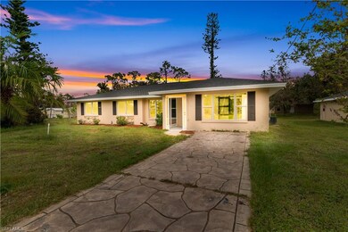 Ranch-style home with a lawn