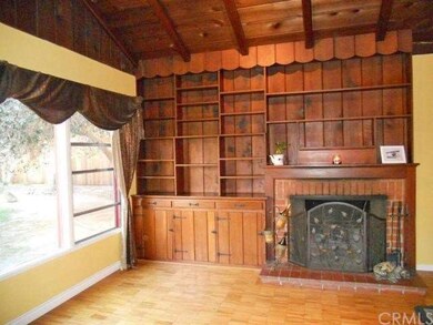 Built-in bookshelves that frame the wood-burning f