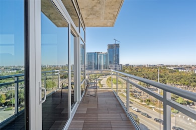 Extending seamlessly from the living room, this spacious balcony offers a perfect fusion of luxury and relaxation. With panoramic views stretching across the cityscape and lush green spaces below, it provides an ideal retreat for morning coffee or evening sunsets.