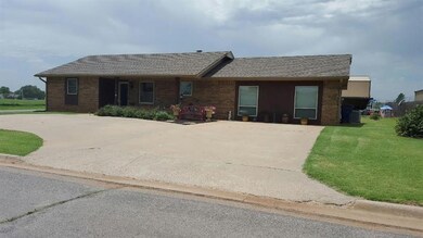 Front of the home with a circle drive