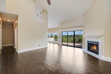 Unfurnished living room with a high ceiling, wood