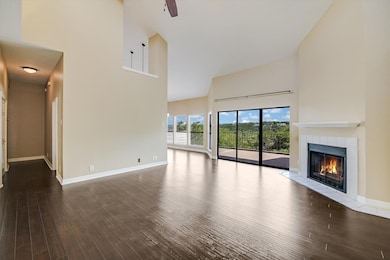 Unfurnished living room with a high ceiling, wood