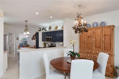 Dining area featuring chandelier and tile floors l