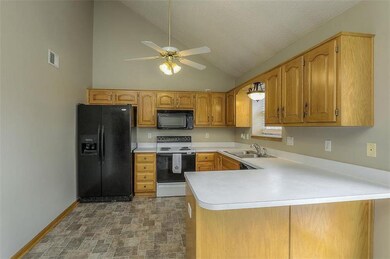 Kitchen with lots of storage and refrigerator stay