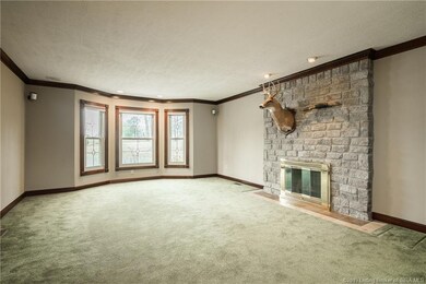 Spacious front living room with fireplace, nice wo