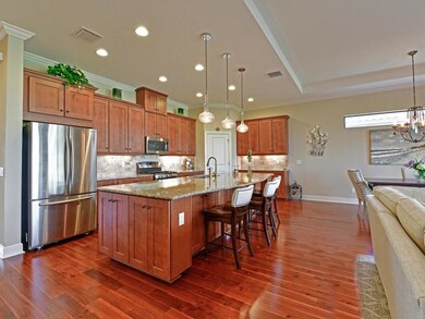 Gorgeous wood floors throughout! French door refri