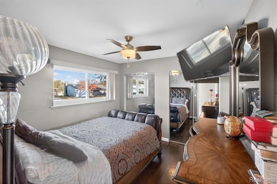 Bedroom with wood finished floors and ceiling fan