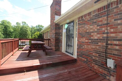 Home has deck and covered patio