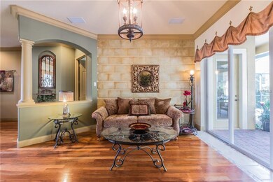 Enter into this lovely sitting area with cherry wo