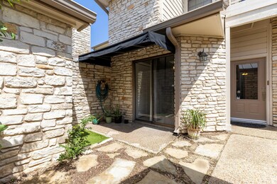 Doorway to property with stone siding